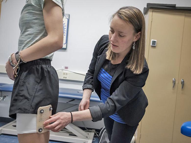 Occupational therapy student working on a patient